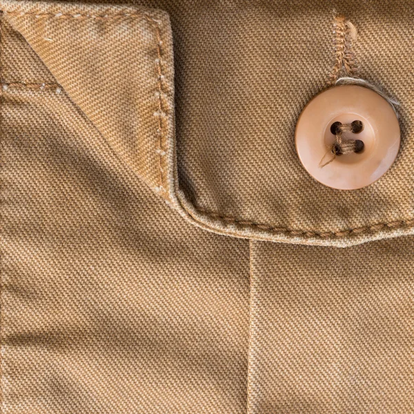 Front pocket on brown shirt textile texture background — Stock Photo, Image