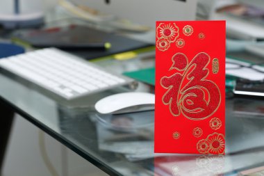 red envelope gift on table work of chinese new year celebration clipart