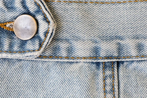 Jeans denim ropa con botón de metal en la ropa textil indus — Foto de Stock