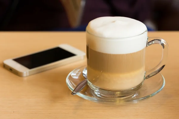 Coffee latte with milk froth in cafe — Stock Photo, Image