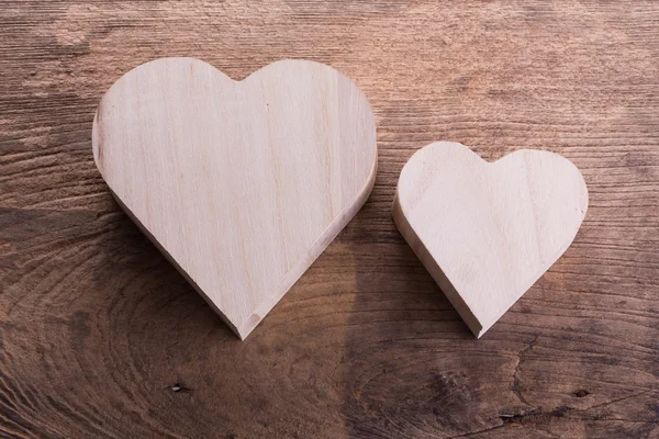 Heart brown wood box on wood background, abstract love