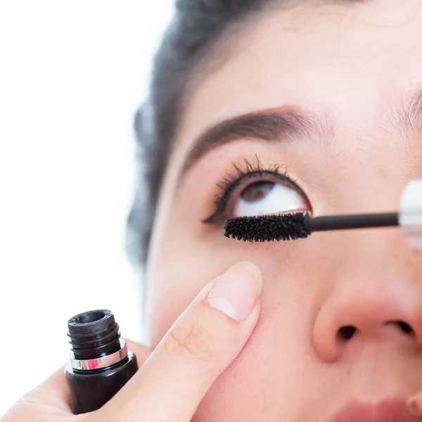 Makeup artist used mascara brush with beautiful woman eyelashes — Stock Photo, Image