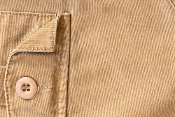 Front pocket on brown shirt textile texture background — Stock Photo, Image