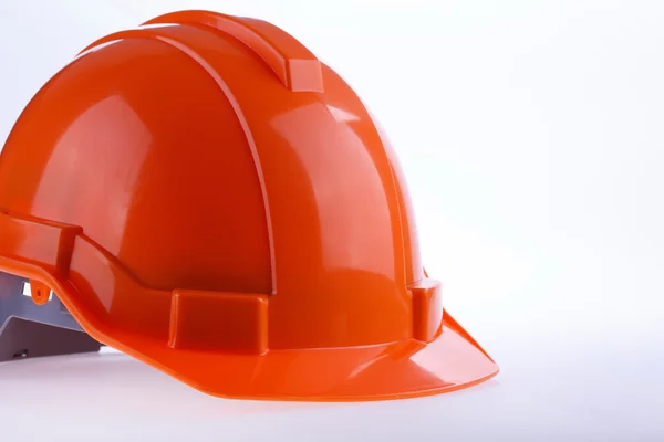 Casco di sicurezza arancione cappello rigido, strumento proteggere il lavoratore di pericolo — Foto Stock