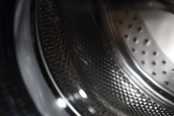 Nahaufnahme einer Waschmaschine, abstrakte metallische Textur — Stockfoto