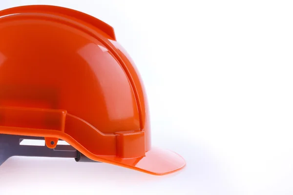 Orange safety helmet hard hat, tool protect worker of danger — Stock Photo, Image