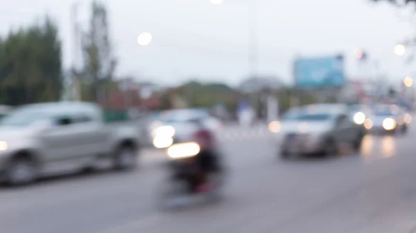 Car and motorcycle driving on road with traffic jam in the city — Stock Photo, Image