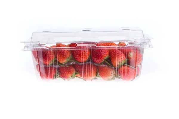 Red ripe strawberry in plastic box of packaging, isolated — Stock Photo, Image