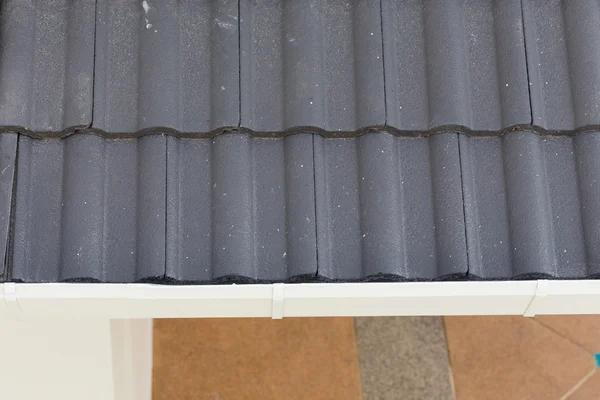 White gutter on the roof top of house — Stock Photo, Image