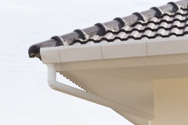 white gutter on the roof top of house clipart