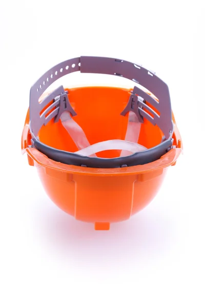 Pomarańczowy bezpieczeństwo kask twardy kapelusz, narzędzie ochrony pracownika o niebezpieczeństwie — Zdjęcie stockowe