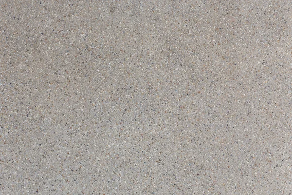 Hintergrund aus Sand und kleinen Kiessteinstrukturen — Stockfoto