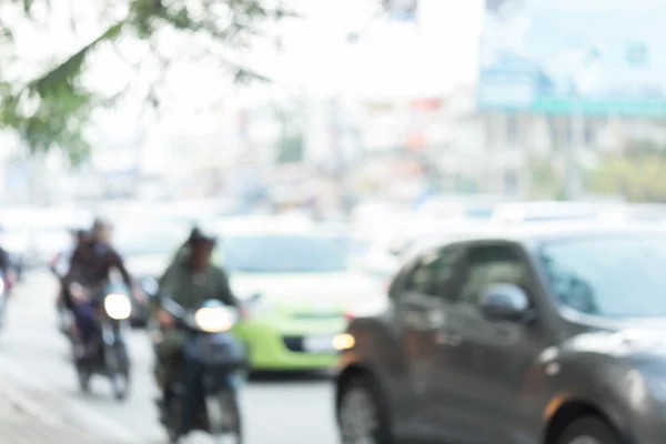 Car and motorcycle driving on road with traffic jam in the city — Stock Photo, Image