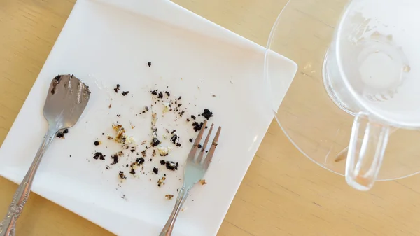 Leftover of milk with glass on wood table — Stock Photo, Image