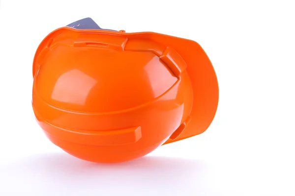 Orange safety helmet hard hat, tool protect worker of danger — Stock Photo, Image