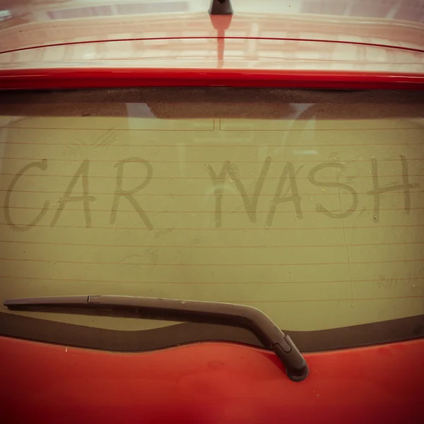 Text of car wash on back mirror dirty car — Stock Photo, Image