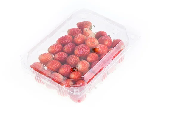 Red ripe strawberry in plastic box of packaging, isolated — Stock Photo, Image