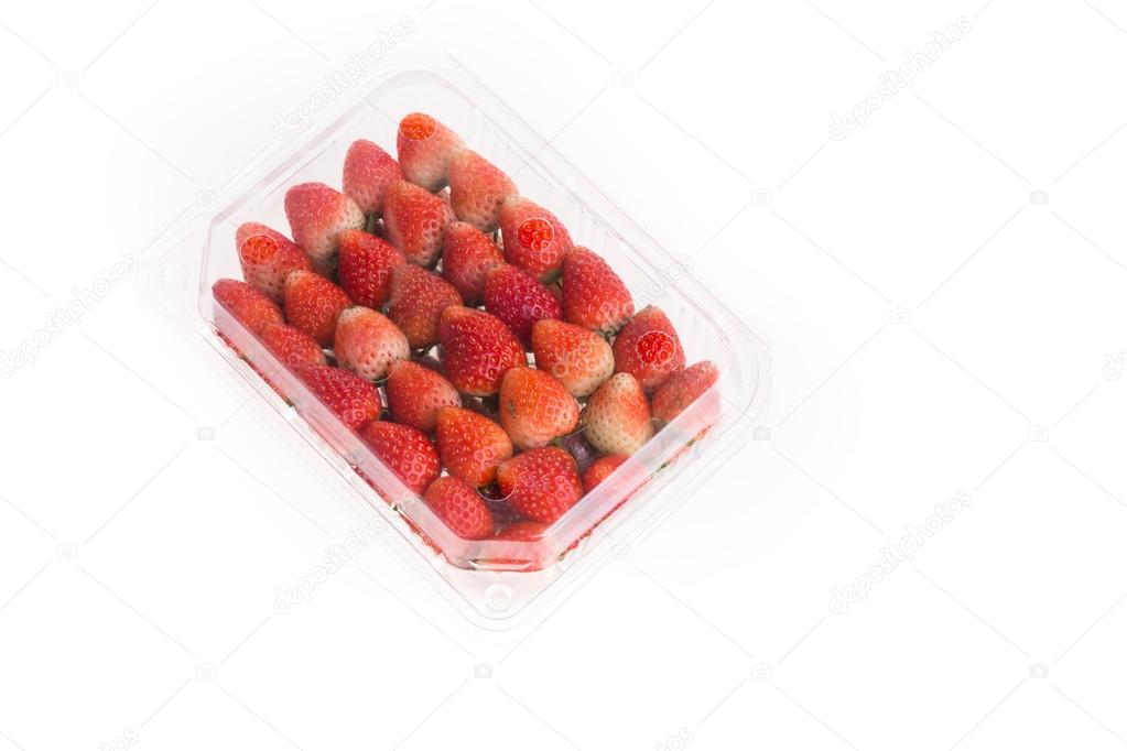 red ripe strawberry in plastic box of packaging