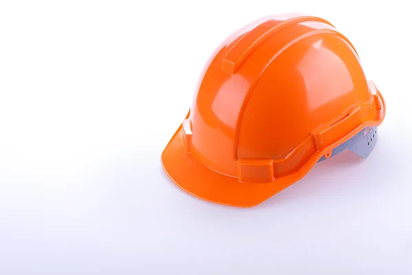 Orange safety helmet hard hat, tool protect worker of danger — Stock Photo, Image