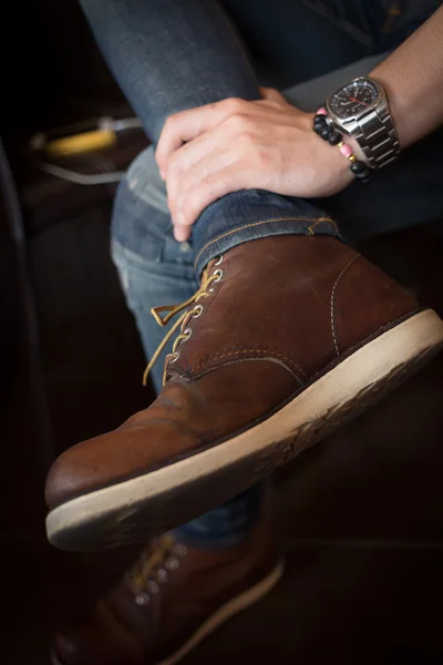 Brown boot leather shoes and jean pants clothing fashion of man — Stock Photo, Image