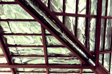 roof with steel beam and silver foil insulation heat on ceiling clipart