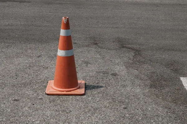 Parking lot with traffic cone on street used warning sign — Stock Photo, Image