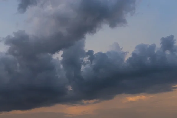 Rain cloud on sunset sky background — Stock Photo, Image