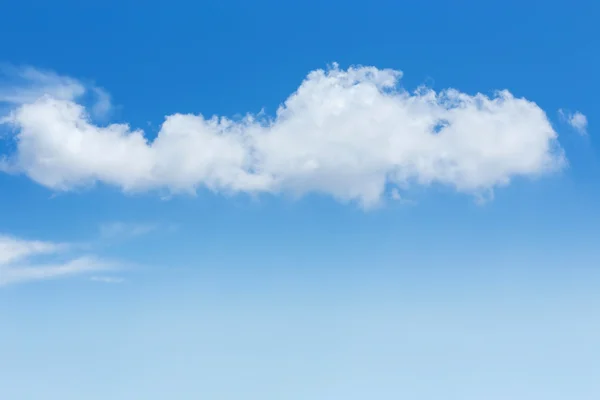 single cloud on clear blue sky background