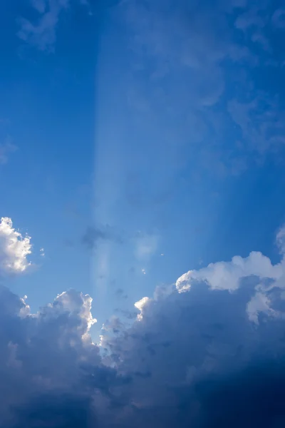 Sun beam in blue sky with clouds background — Stock Photo, Image