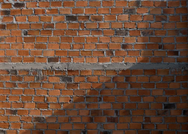 Ladrillo de pared en el sitio de construcción de edificios residenciales —  Fotos de Stock