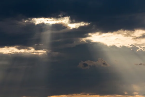 ray light of sun through cloud
