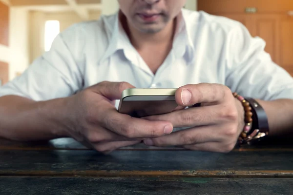 Businessman using a mobile phone with texting message — Stock Photo, Image