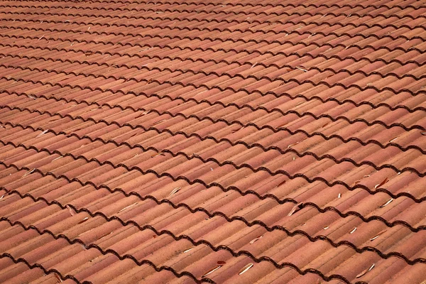 Brown tile roof weathered on building residential — Stock Photo, Image