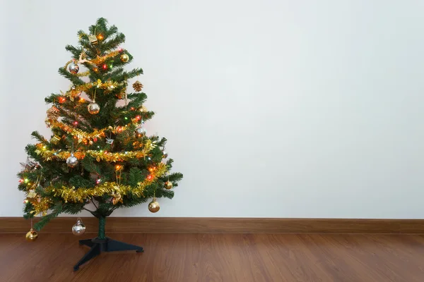 christmas tree decoration in empty room with white wall