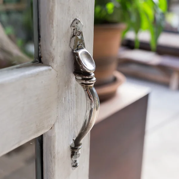 open the door, close-up door handle style ancient on vintage