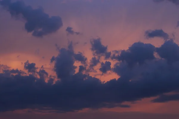 Black rain cloud on sunset sky background — Stock Photo, Image