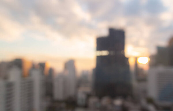 Abstract blurred city sunrise background. Bangkok, Thailand, Asia
