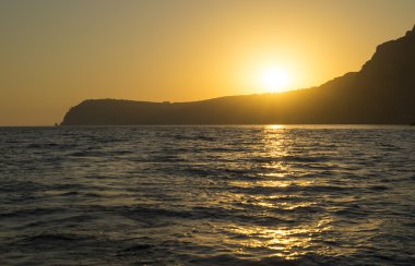 Cape Denizi üzerinden günbatımı