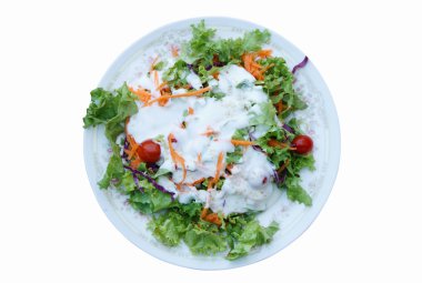 Taze salata domates ve havuç, üstten görünüm ile krem.