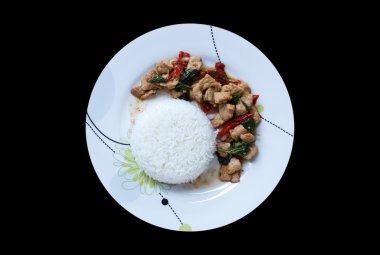 Kızarmış domuz eti ve fesleğenli pilav.