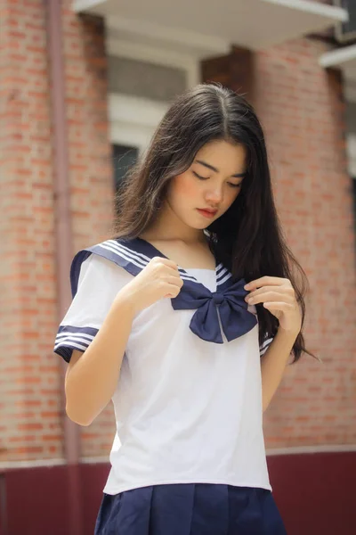 japanese teen beautiful girl in student uniform happy and relax