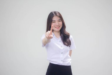 Taylandlı yetişkin öğrenci üniforması. Güzel kız işaret ediyor.