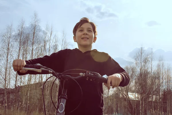 Boy Holds Handlebars His Bike Smiles Background Light — Stock Photo, Image