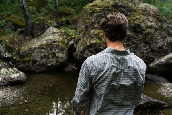 Young Man Stands Forest Look Back — Stock Photo, Image