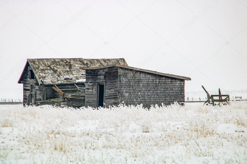 Abondoned farm buildings on a frosty morning. Keoma, Alberta, Canada