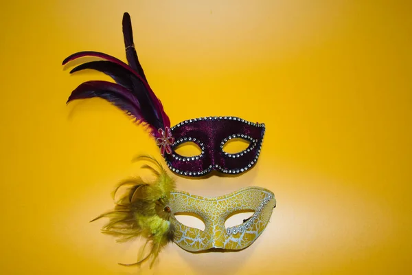 Two Carnival Masks One Yellow One Purple Withe Feathers Yellow — Stock Photo, Image