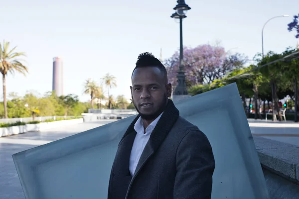 African-American man on a business trip to Europe takes advantage of a few days to go sightseeing in Seville. Spain.