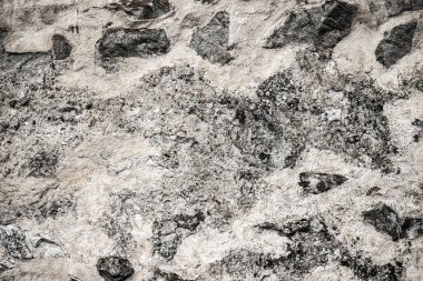 Taş bir duvarın dokusu. Eski kale taşından duvar dokusu. Arka plan ya da doku olarak taş duvar. Bir taş duvarın parçası, arkaplan veya doku için.