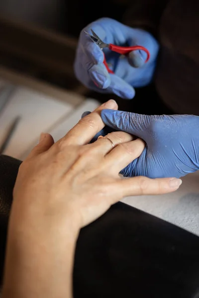 Closeup Shot Woman Nail Salon Receiving Manicure Butician Woman Getting — Stock Photo, Image