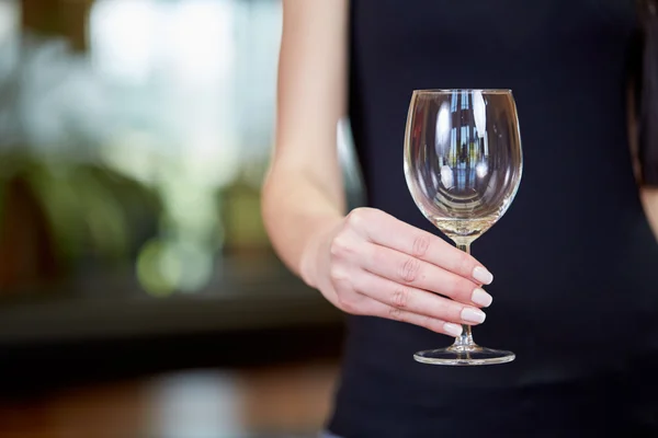 Young caucasian woman holding empty wine glass — Stock Photo, Image